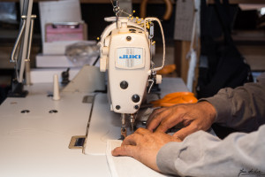 Hands working at Sewing Machine - Sewing Department - Jan de Luz Linens