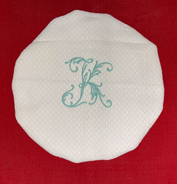 white shower cap or hat with embroidery