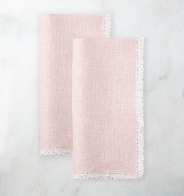 2 light pink napkins