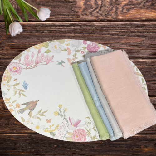 placemat with birds and flowers and 4 light colors napkins